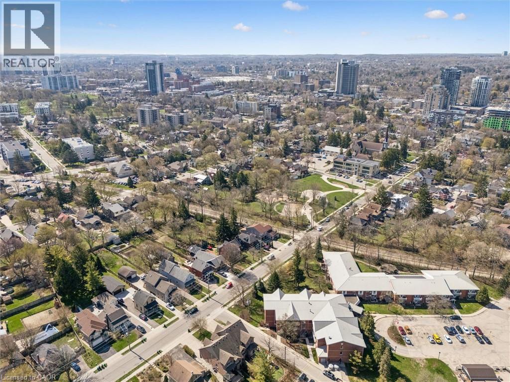 Aerial perspective showcasing a residential area with a mix of detached homes and multi-story buildings