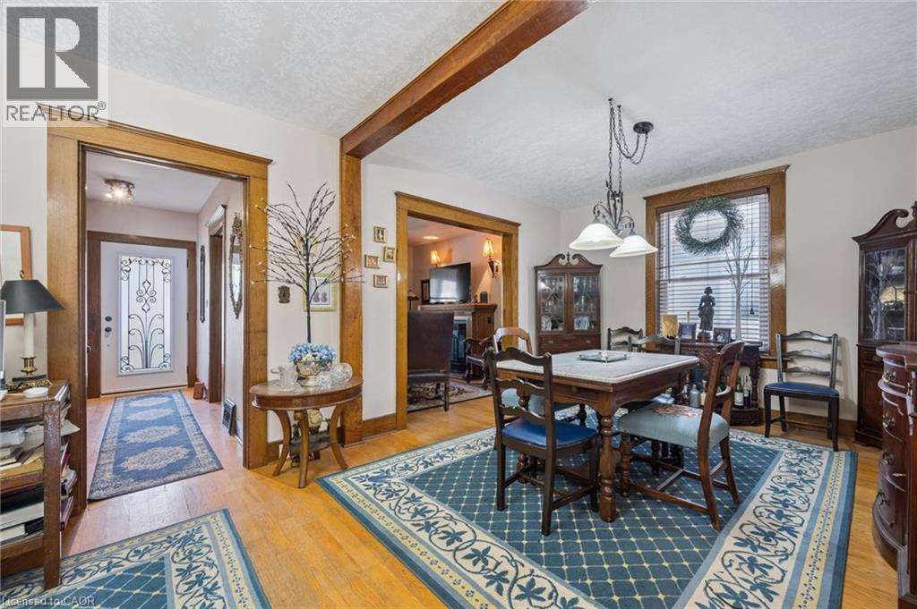 Hardwood flooring throughout the main living areas, featuring wide wooden trim and casings