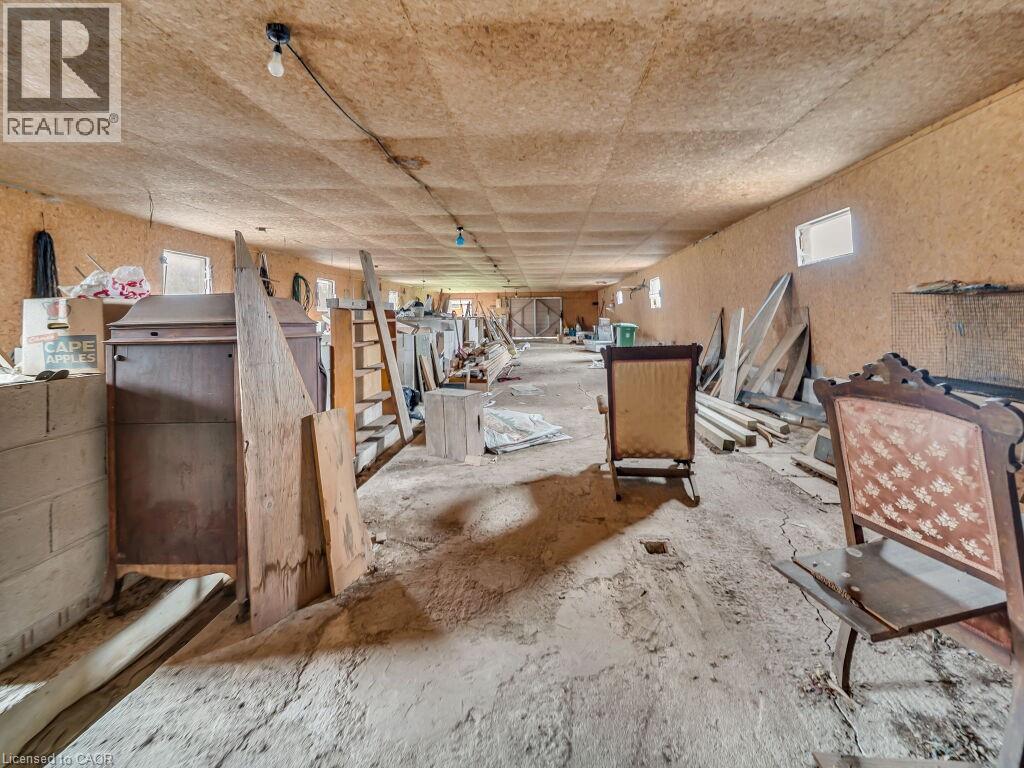 Expansive interior space with wood-finish paneling on walls and ceiling