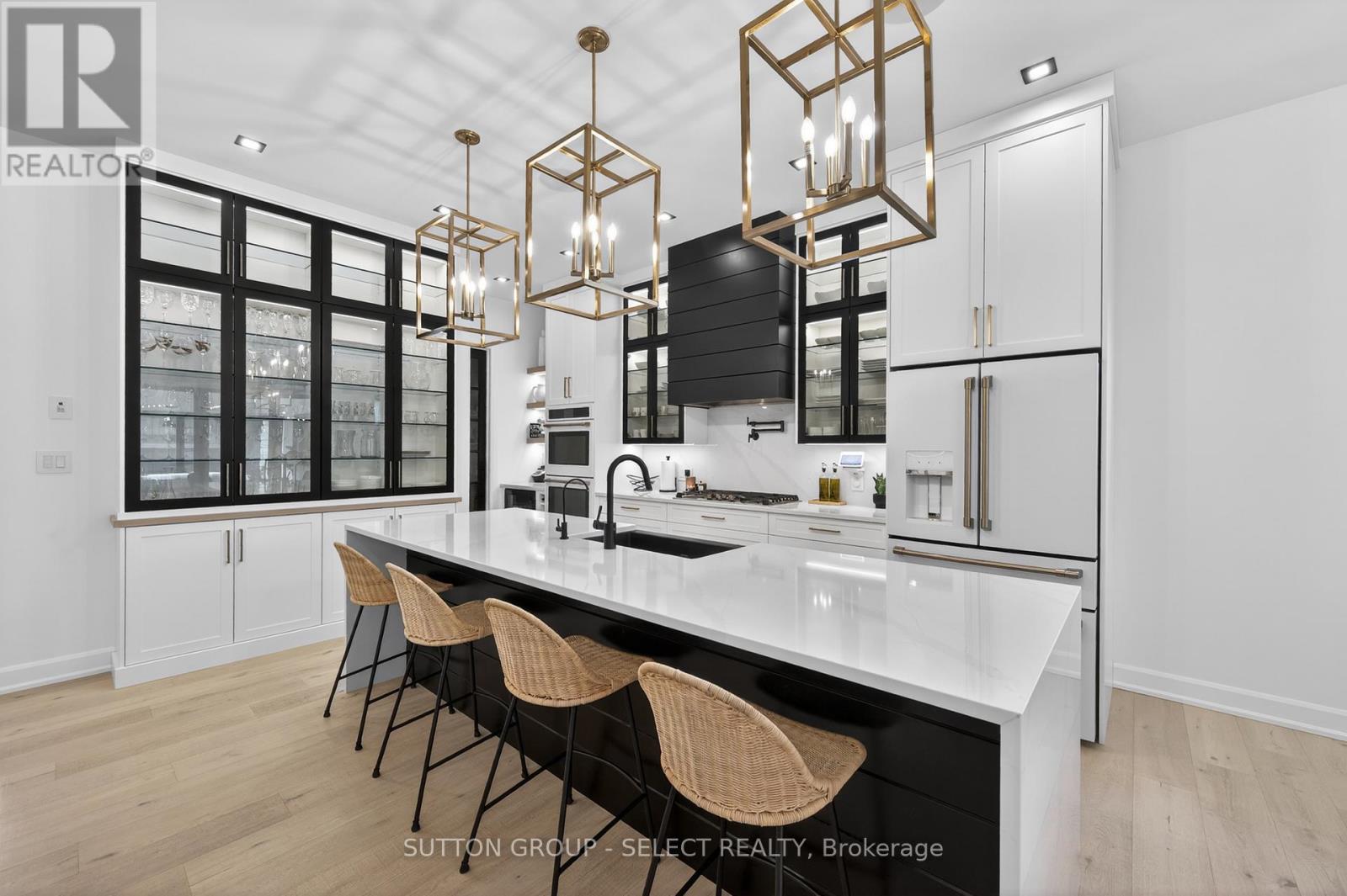 Large waterfall kitchen island with garburator