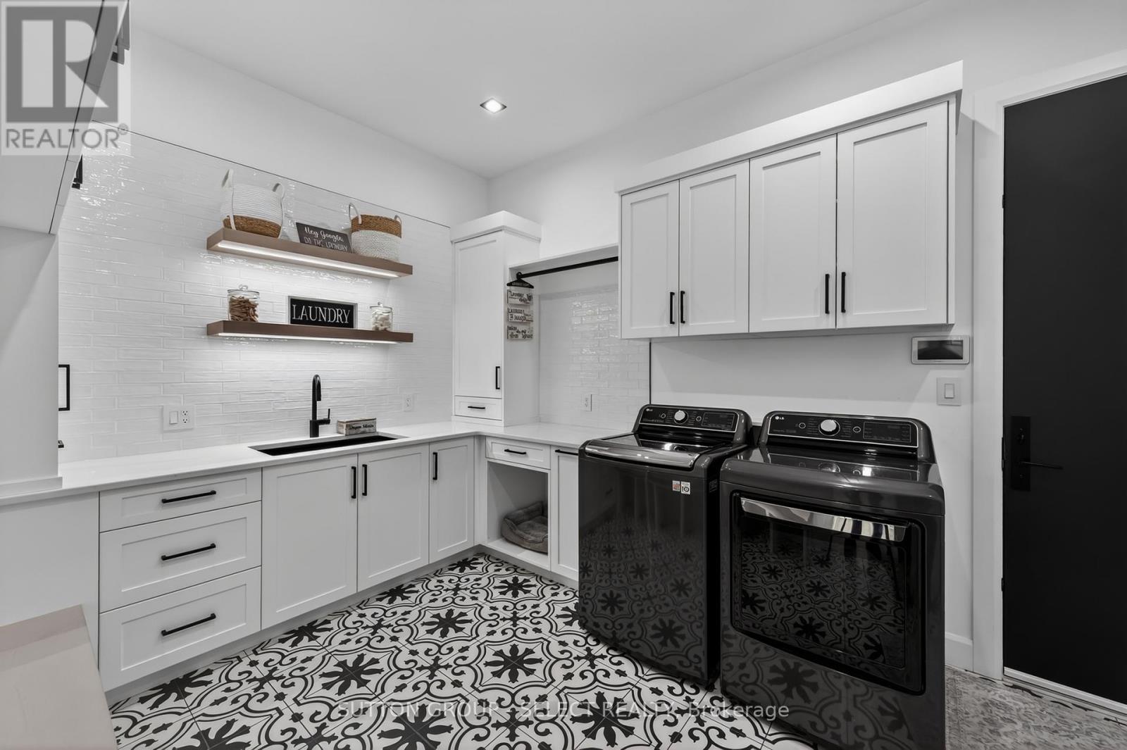 Laundry with lots of cabinets