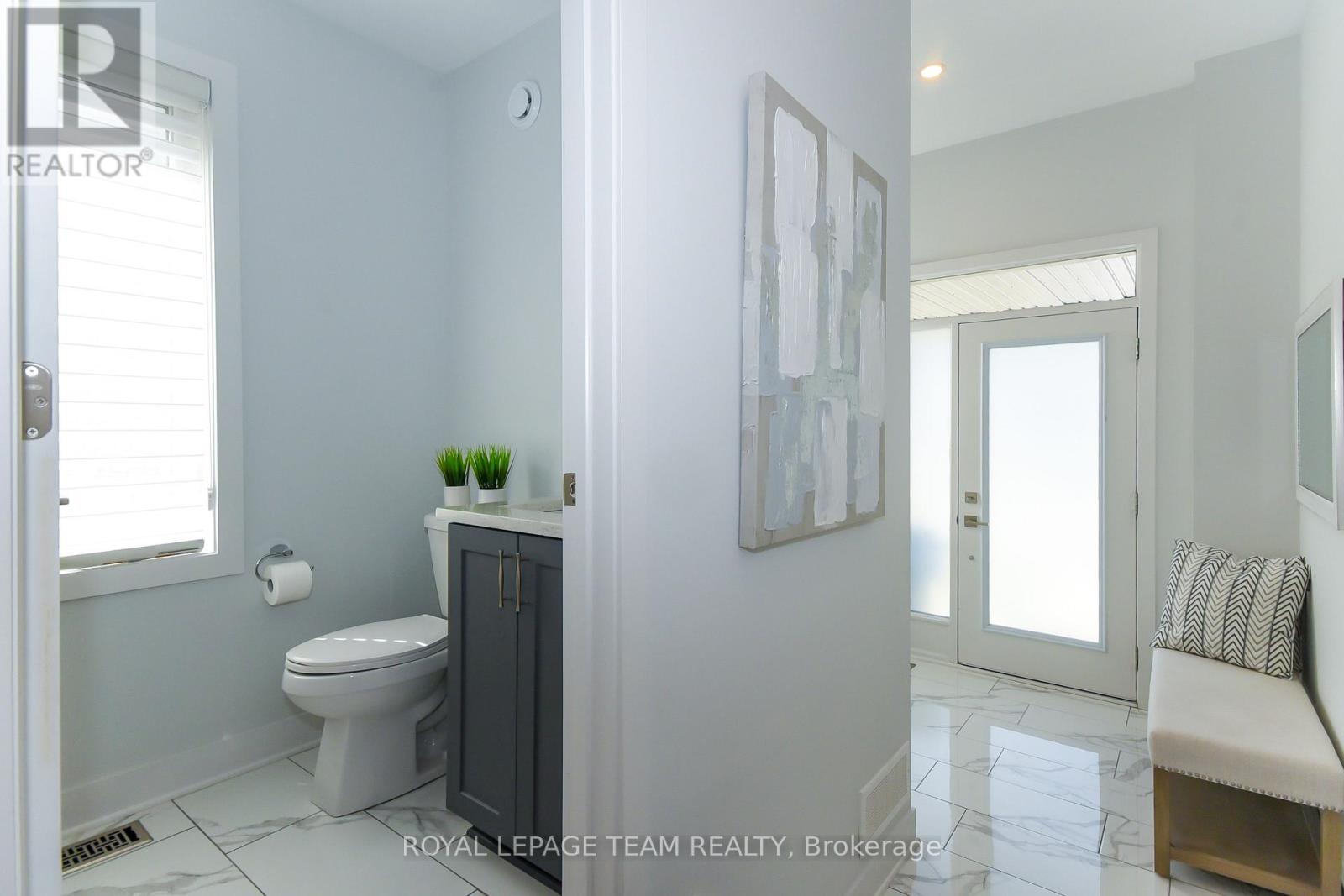 Elegant powder room with tile upgrade