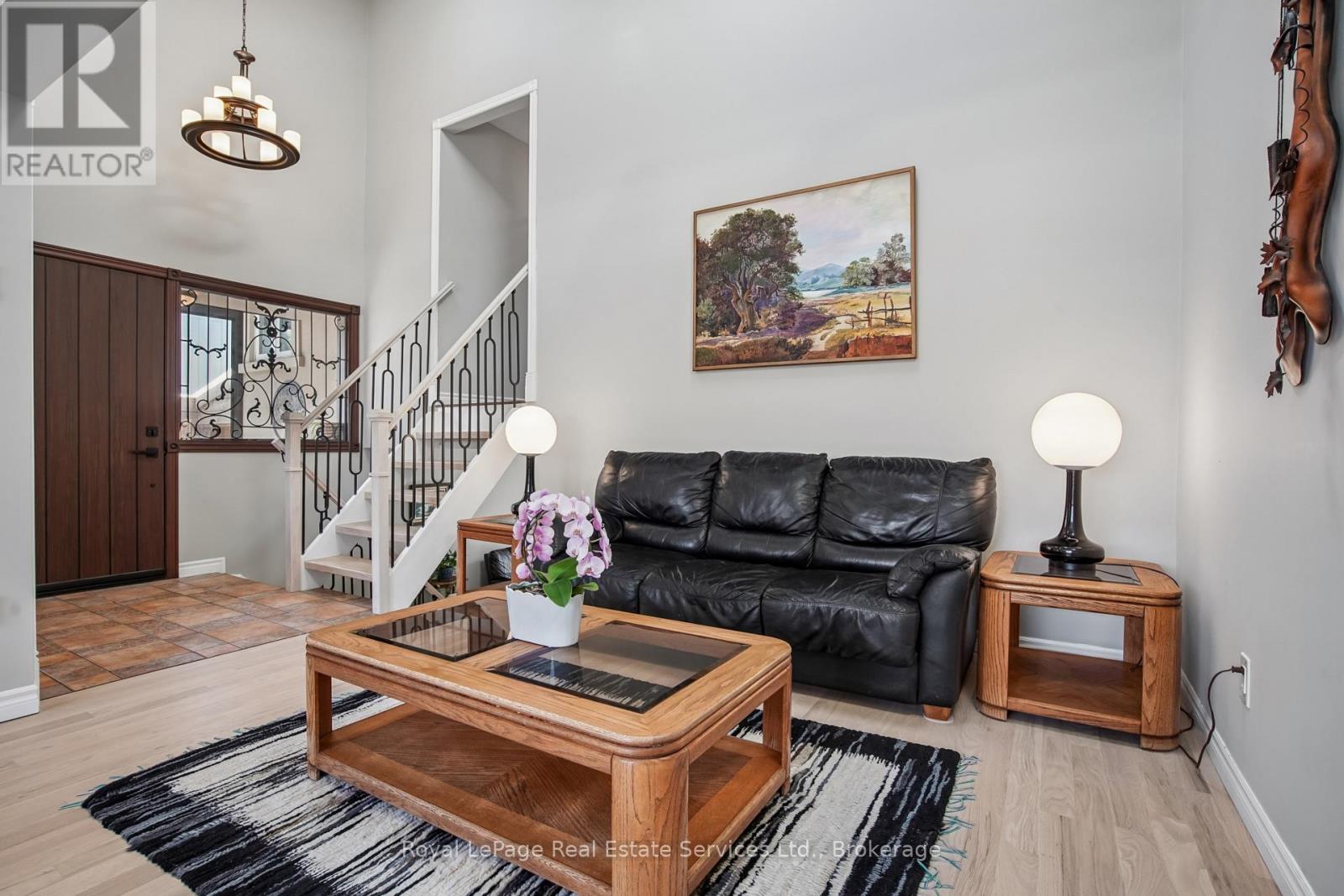 Living Room With Vaulted Ceiling & Ceiling Fan