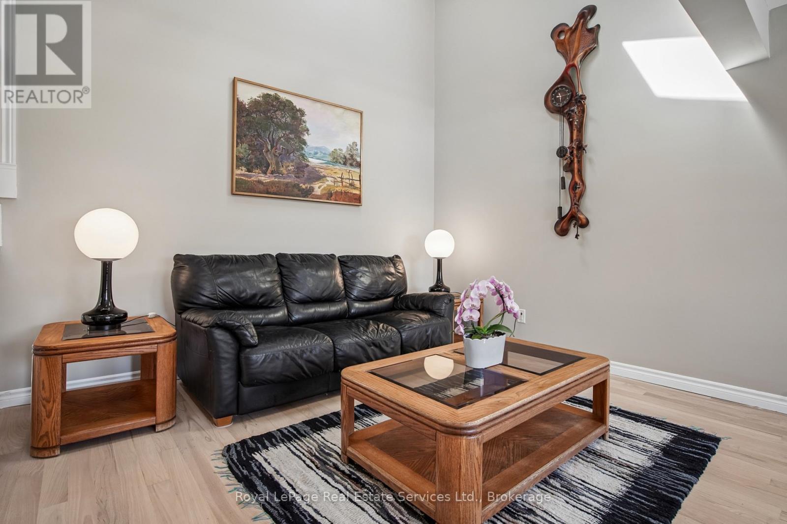 Living Room With Vaulted Ceiling & Two Skylights