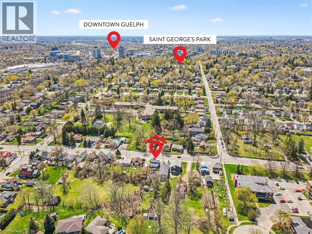 Aerial perspective showcasing a residential area with varied housing styles and mature trees