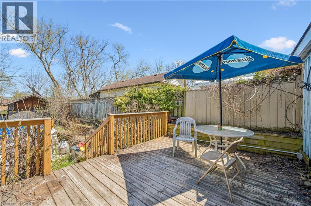 Expansive wood-finish deck with integrated wood railings and steps