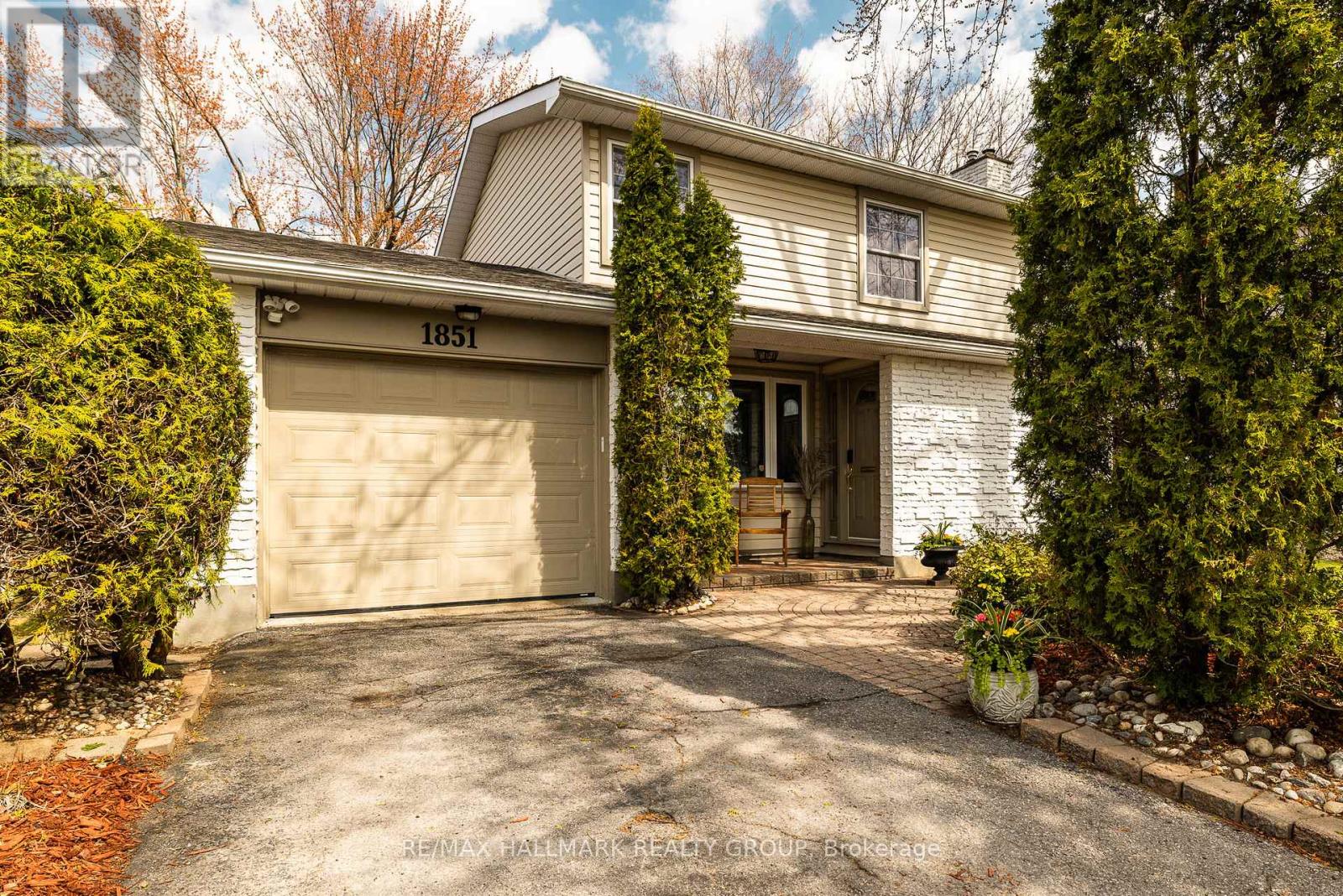 Attached single car garage with backyard access.