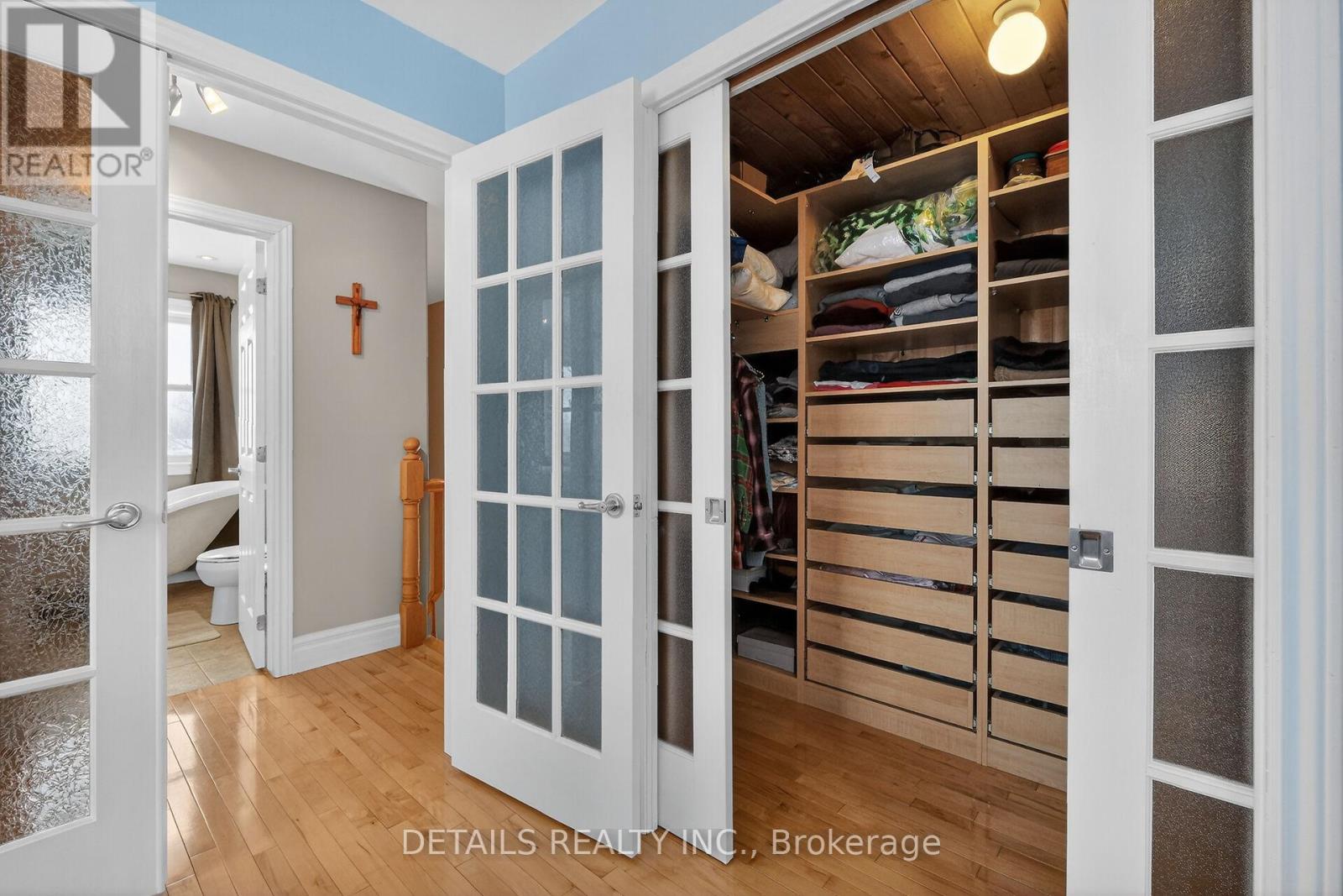 French doors to walk in closet with built ins.
