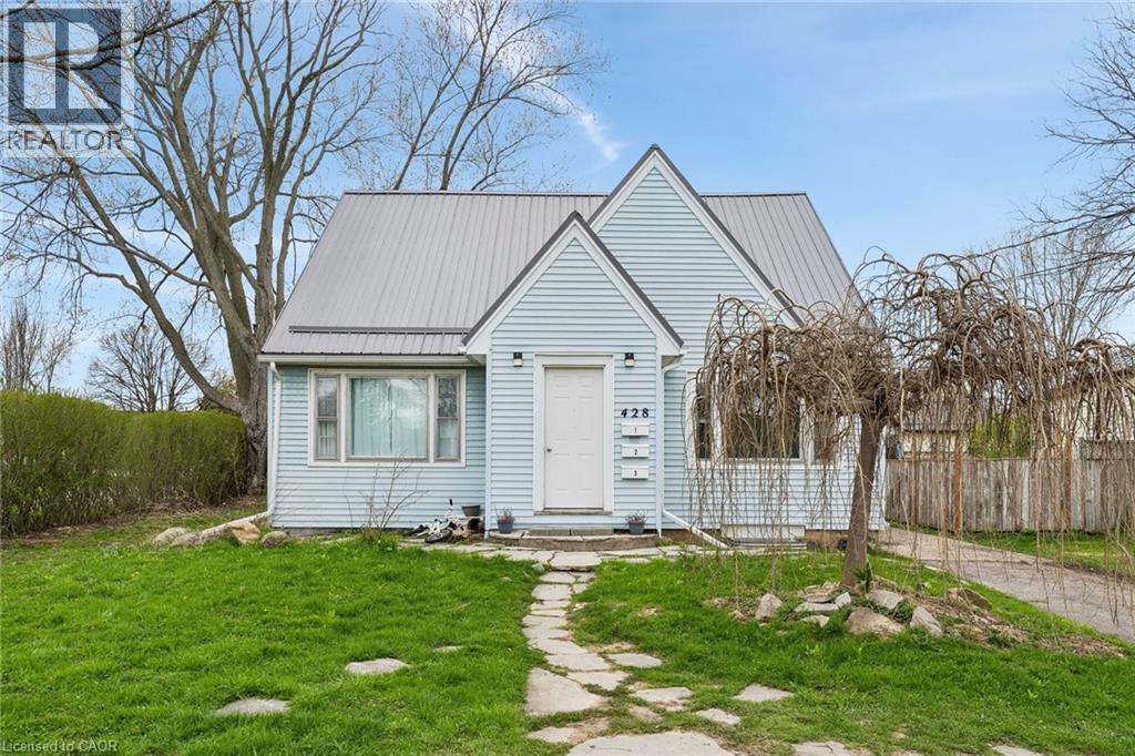 Light blue siding exterior with a metal roof