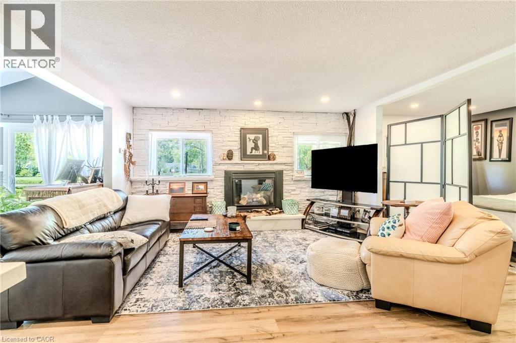 Living area featuring wood-finish flooring and recessed lighting