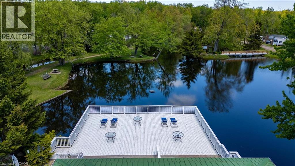 Clubhouse white deck overlooking a tranquil pond