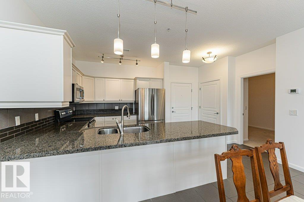 #302 160 MAGRATH RD NW - 8