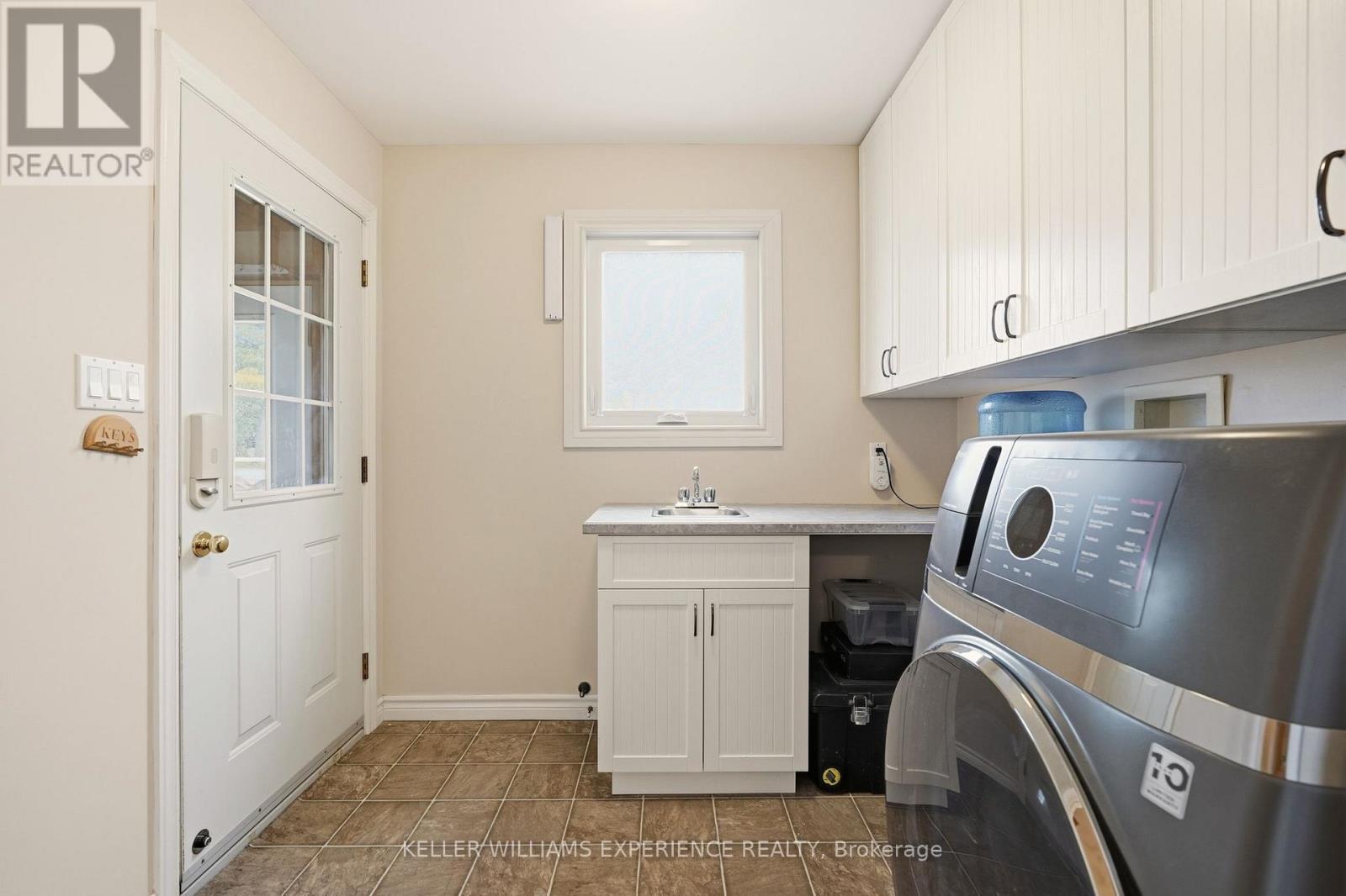Main Floor Laundry with Garage Entry
