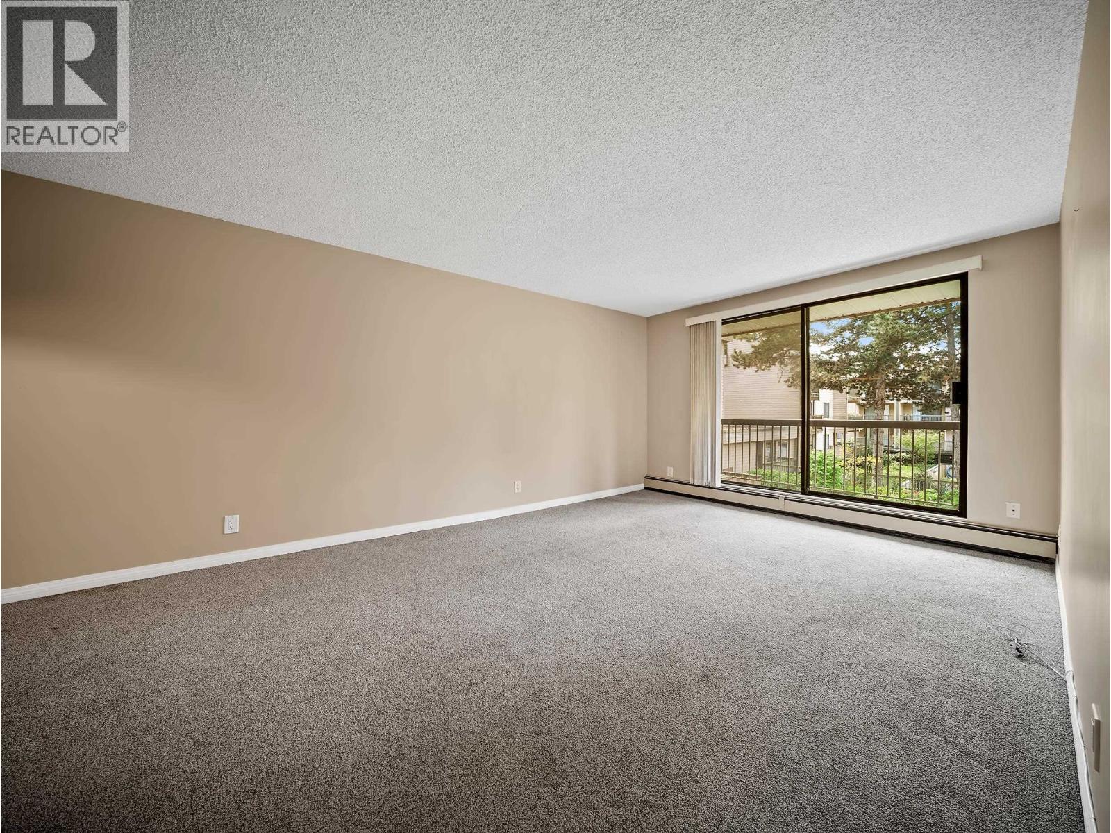 #210-8511 ACKROYD Road, Richmond