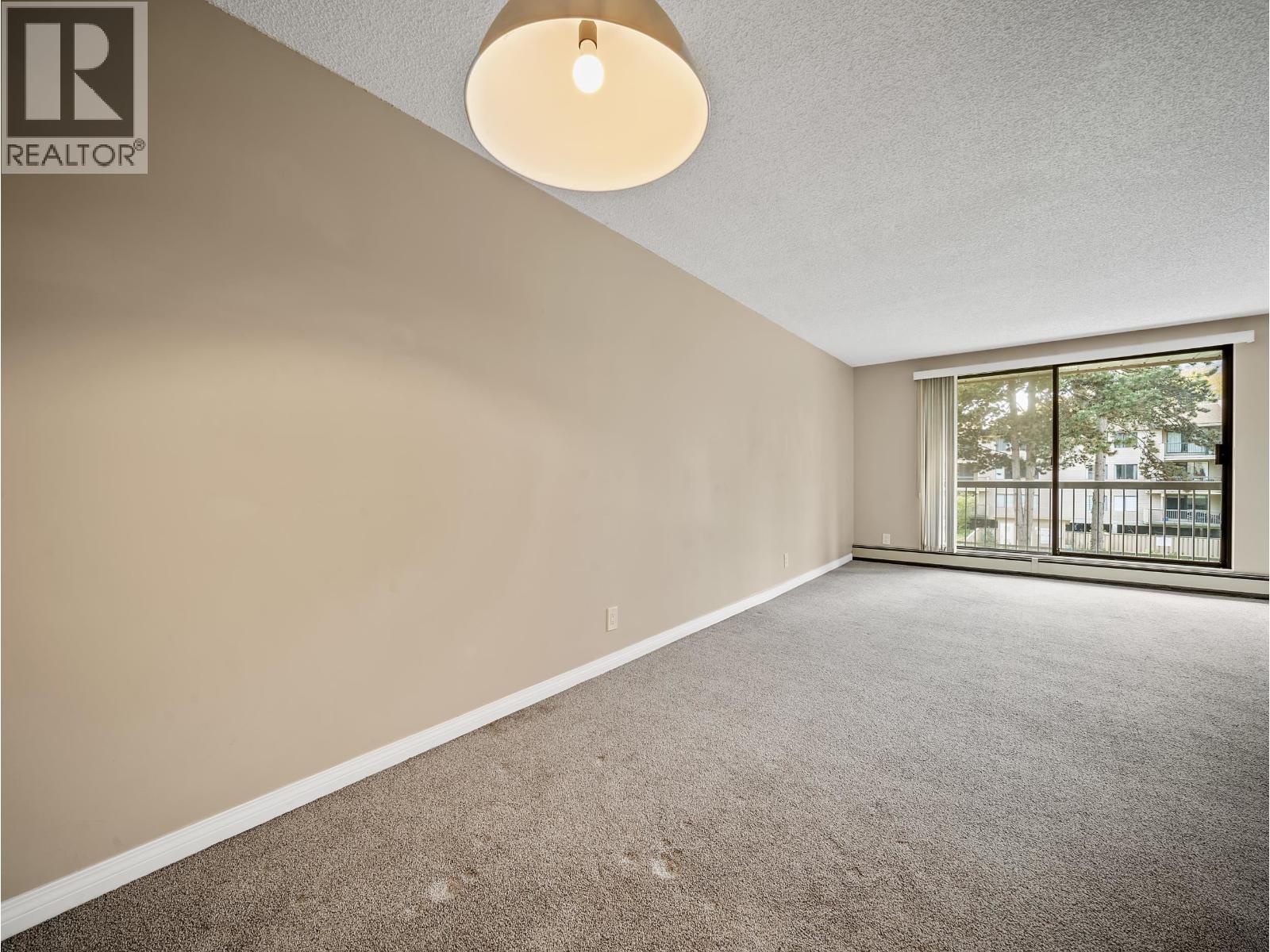 #210-8511 ACKROYD Road, Richmond