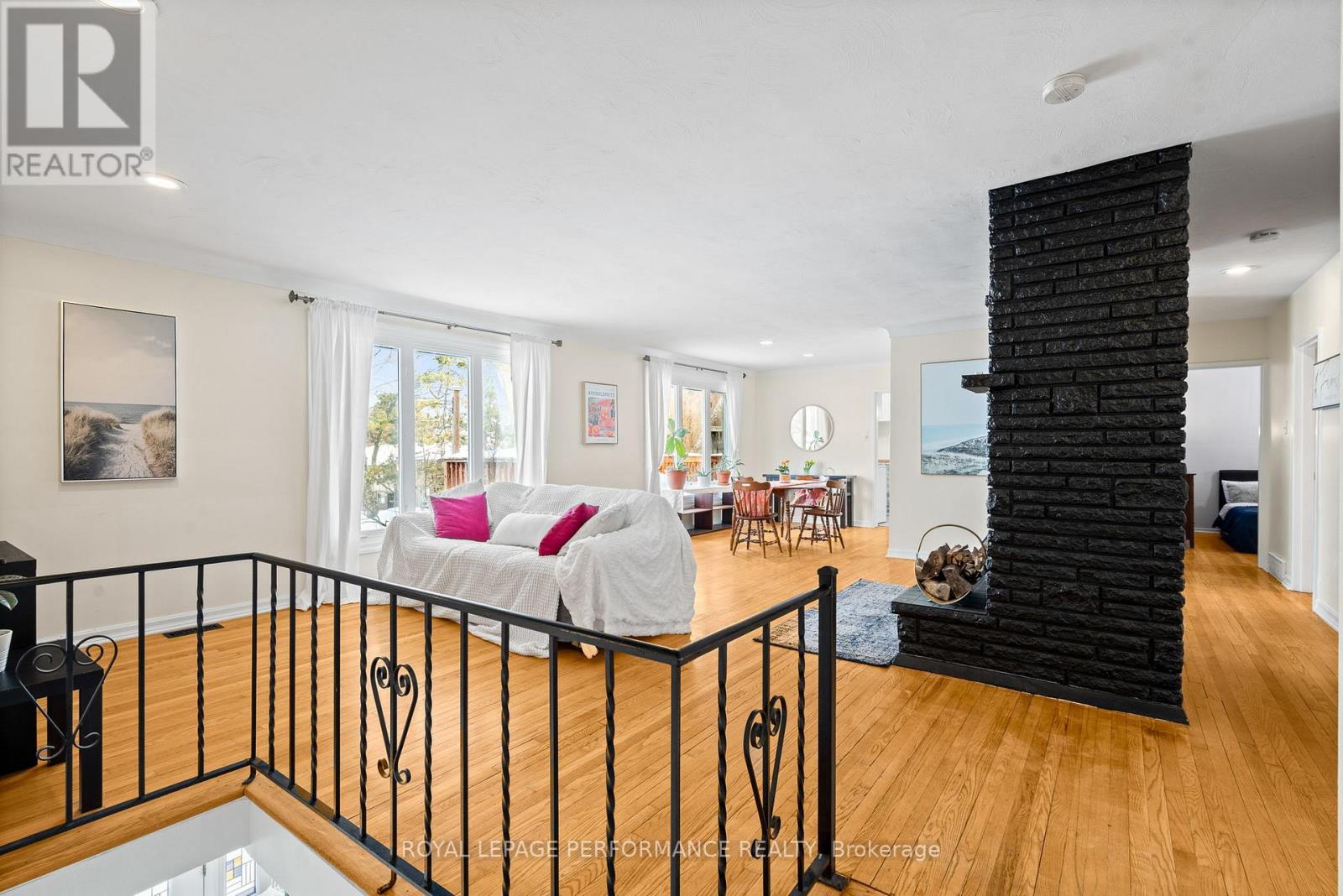 Main level living and dining with a fireplace, too
