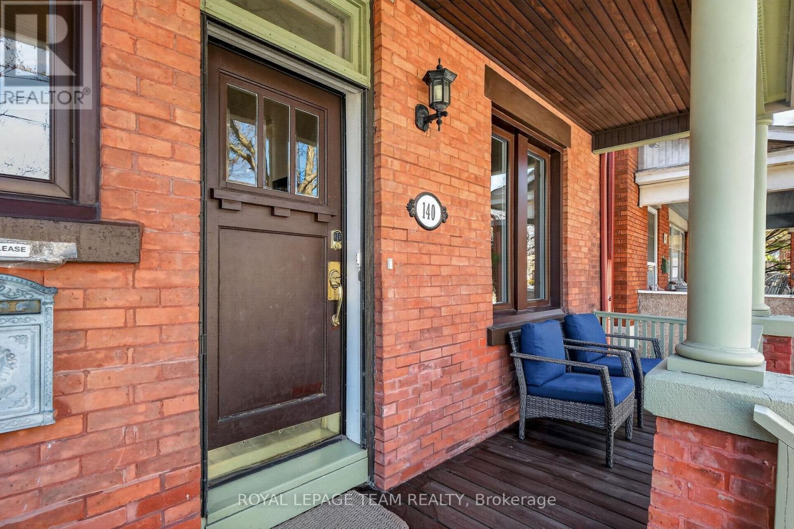 A welcoming old-world front porch sets the tone