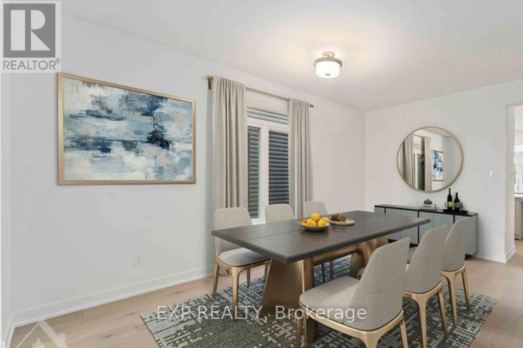 Dng rm w/large window & hdwd flrs virtually staged