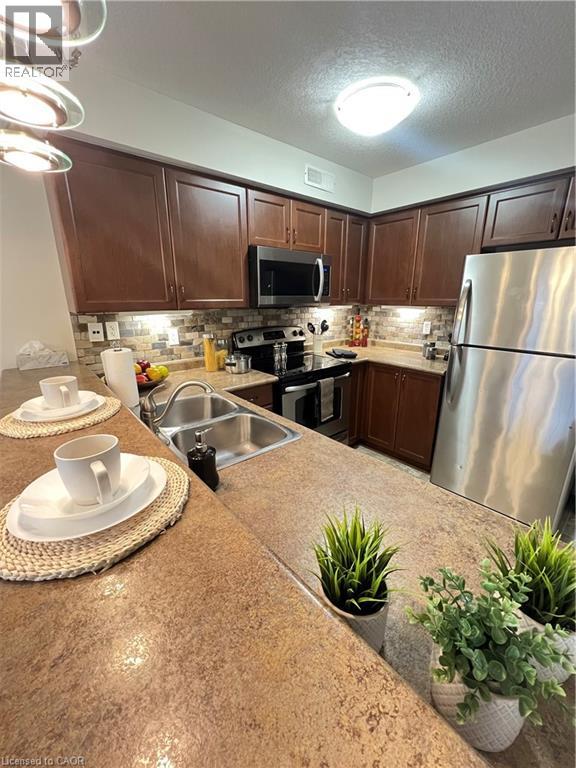 35 MOUNTFORD Drive Unit# 111, Guelph, Ontario, N1E0G6 — Photo 3