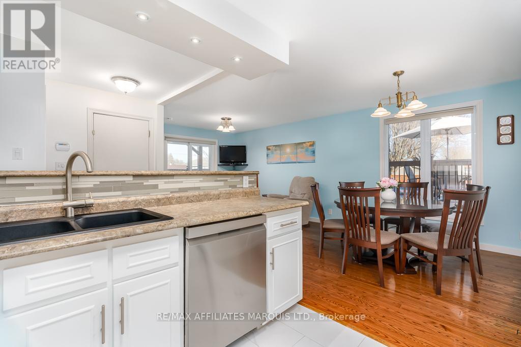 Kitchen with dining and living room views.