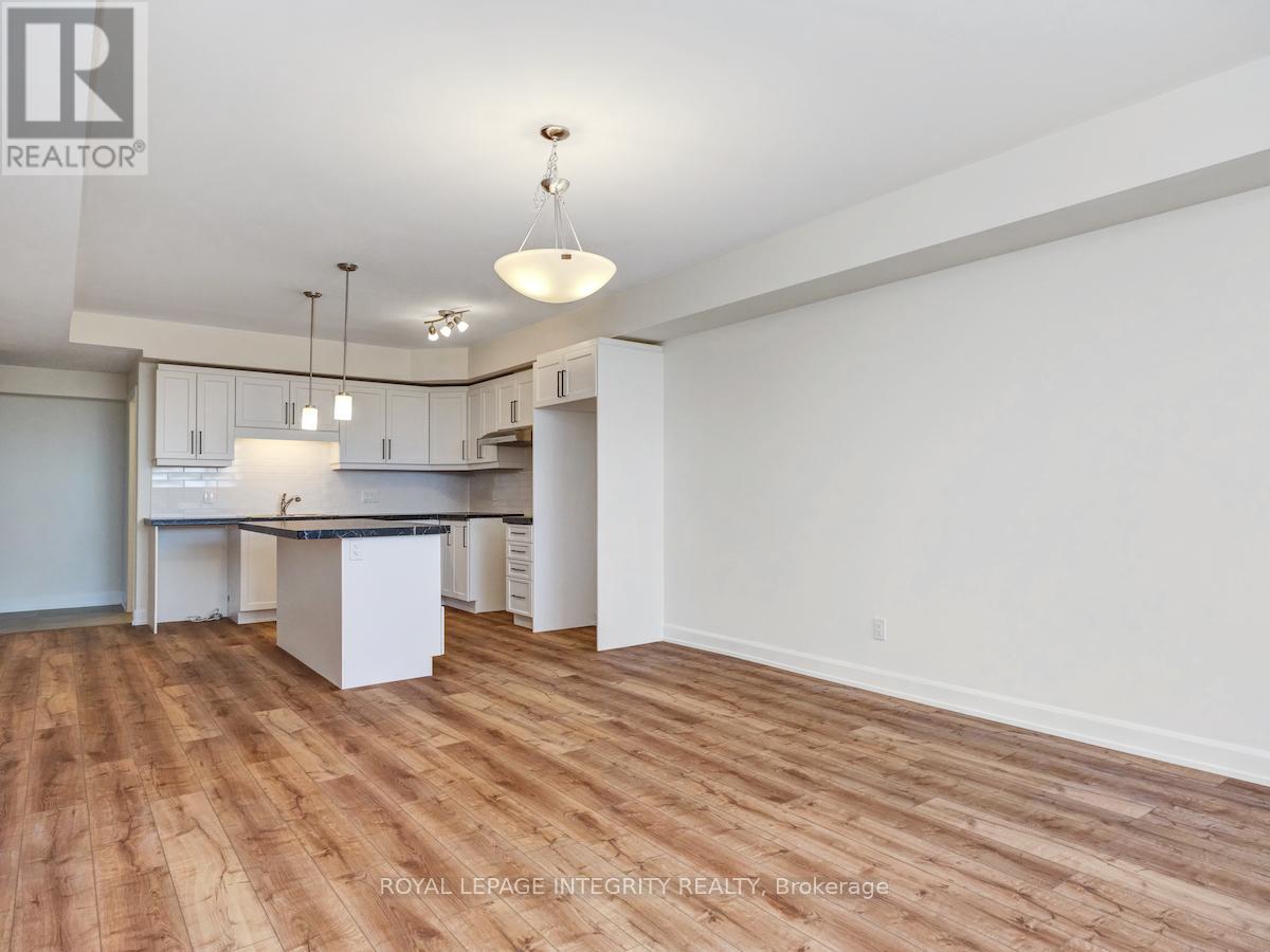 Kitchen has island and lots of storage