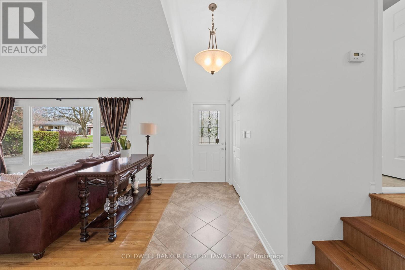 Welcoming ceramic tiled front foyer & closet.