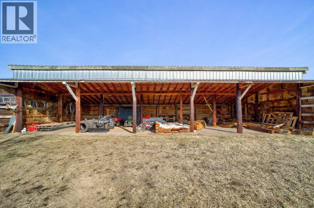 Car port by barn