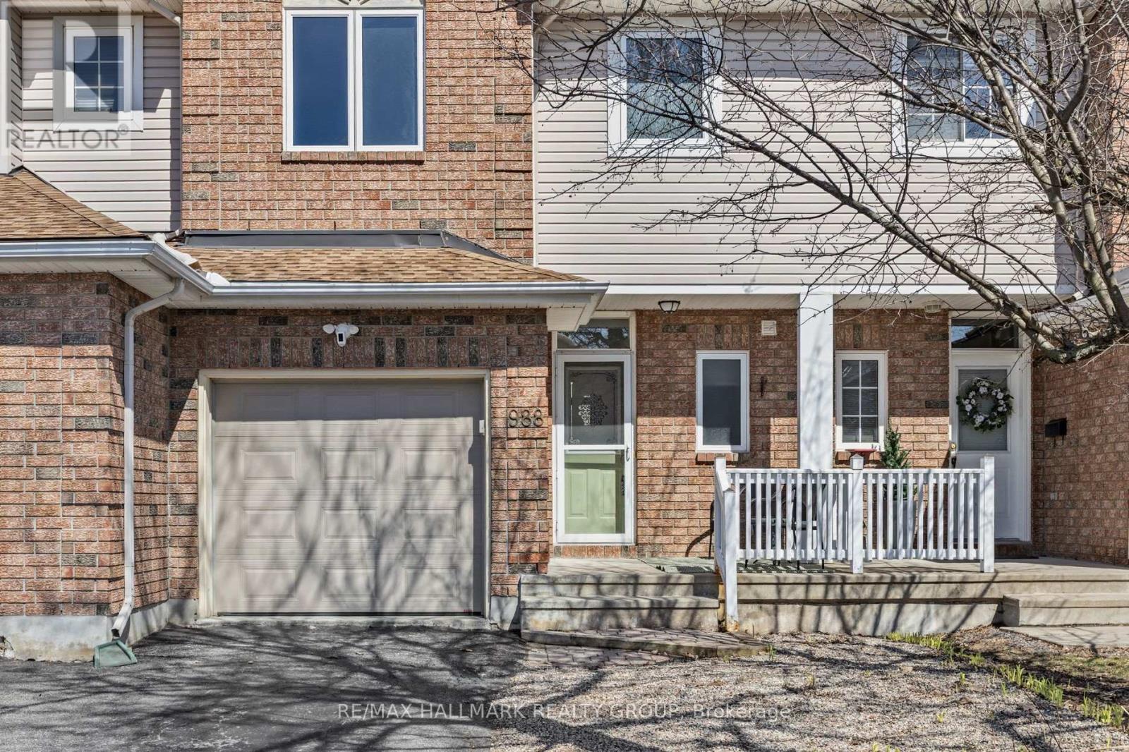 Welcoming front porch w/charming brick exterior