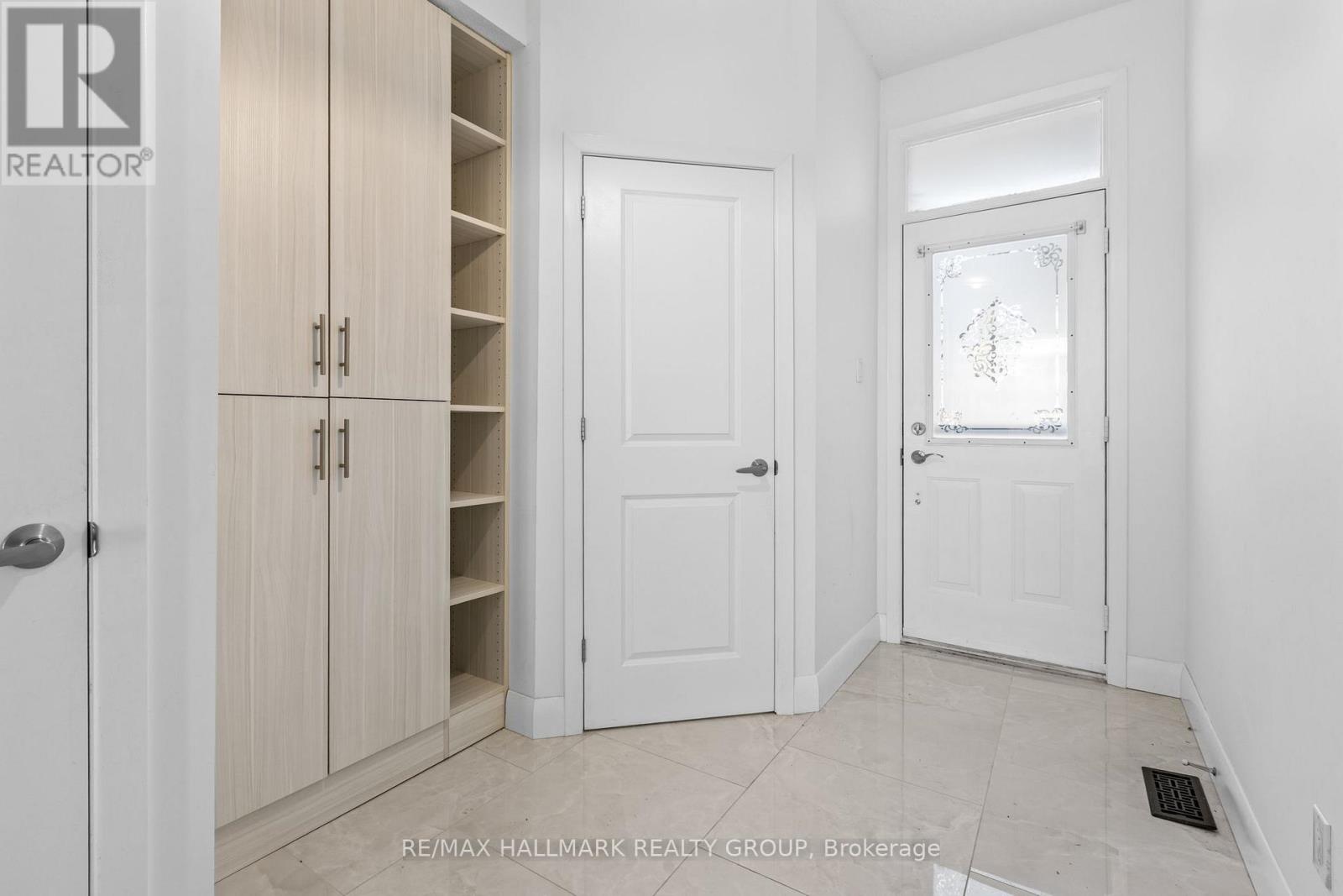 Foyer with custom storage and powder room