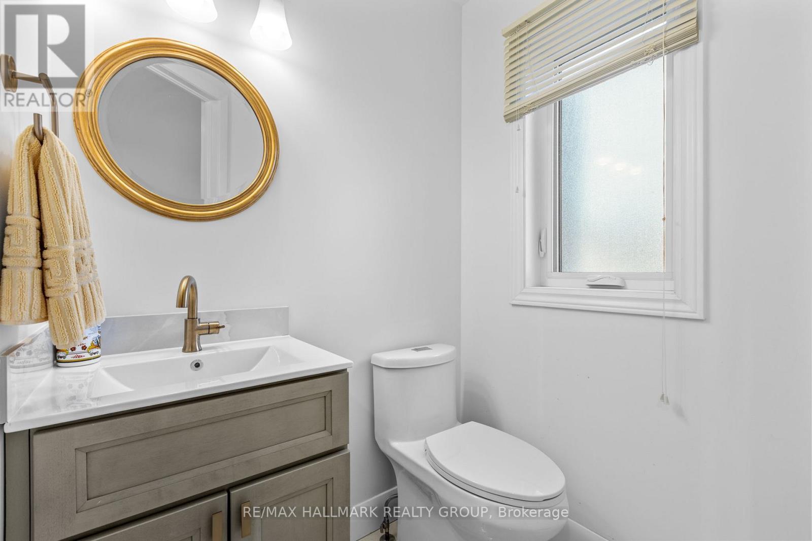 Modern powder room with gold accents