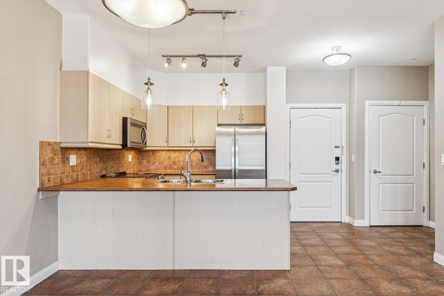 #310 1406 HODGSON WY NW - 9