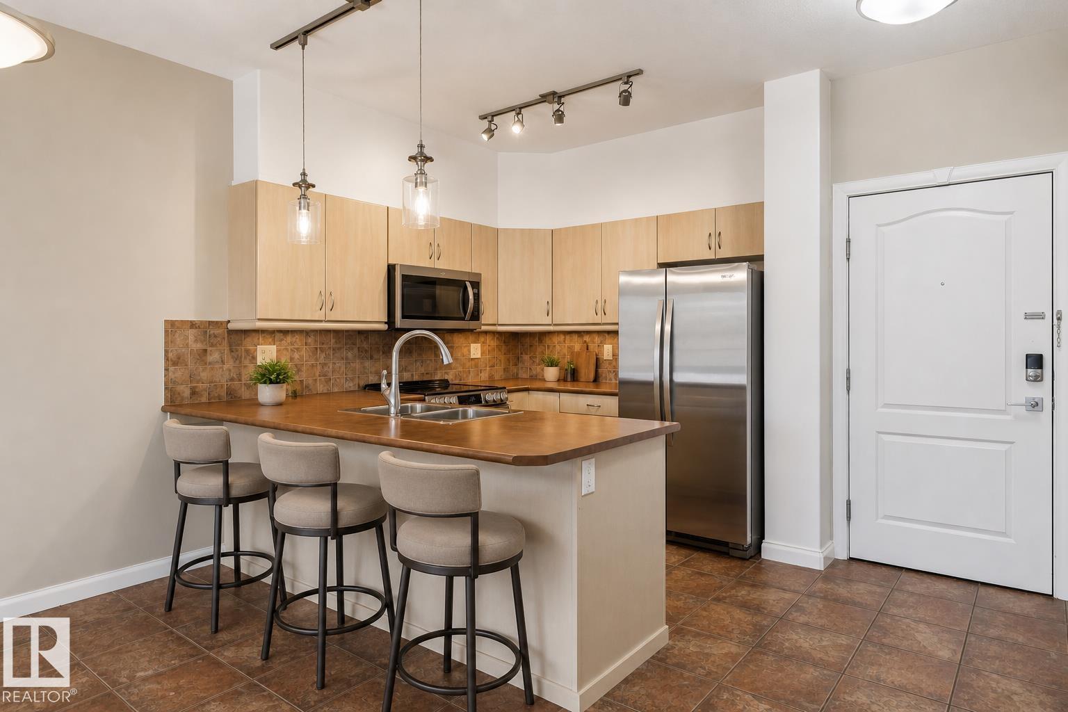 #310 1406 HODGSON WY NW - 3