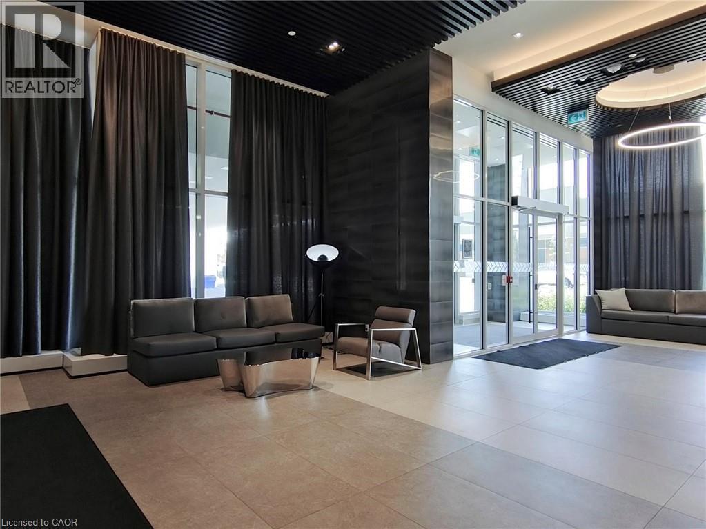Building lobby with floor to ceiling windows and a high ceiling