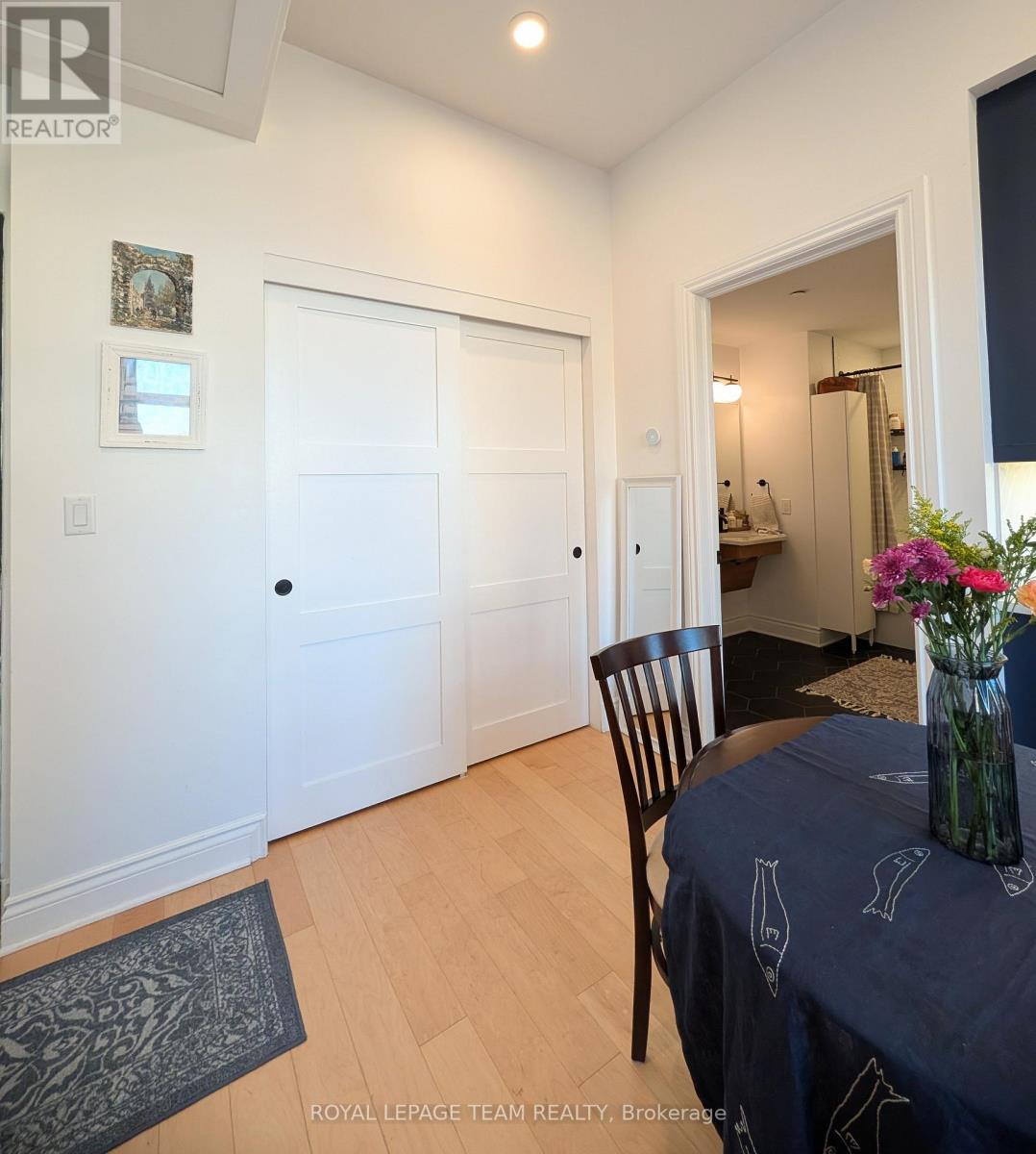 Entry towards handy closet and bathroom