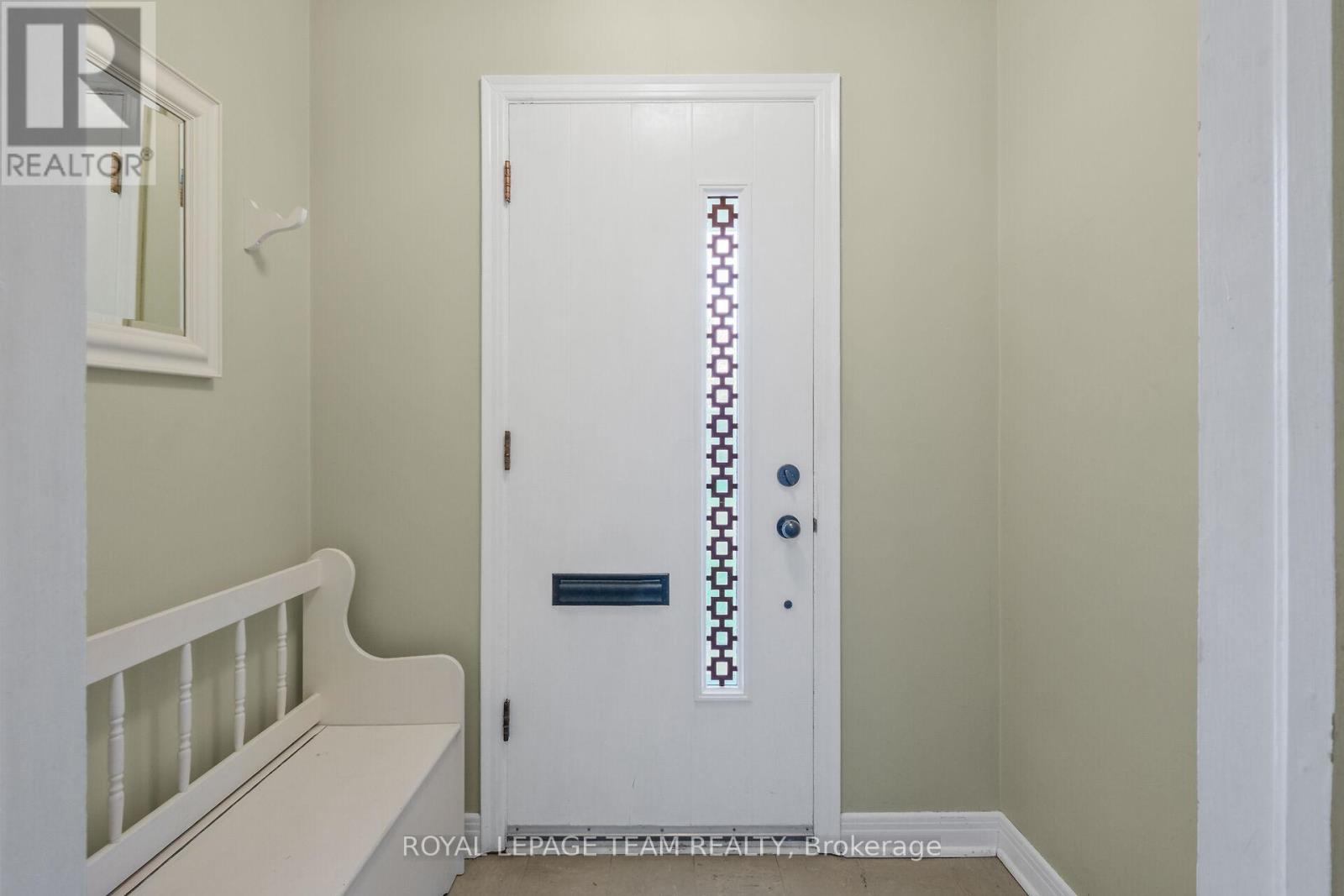 Enclosed entry with glass inset mid century detail