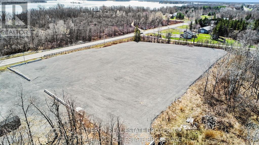 3 acre truck/trailer garaveled parking lot area