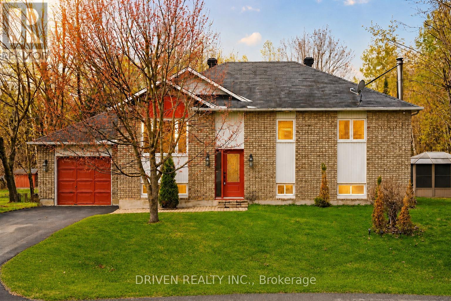 Welcoming front exterior with lush greenery