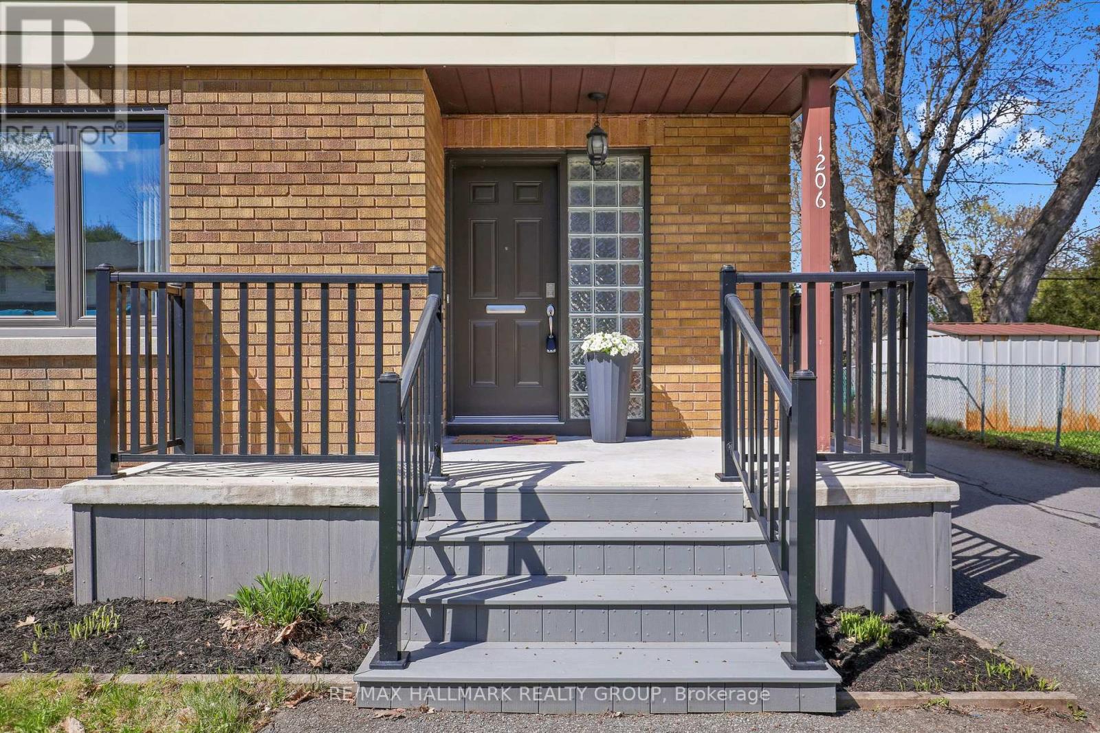 Front porch re-done with metal railings.