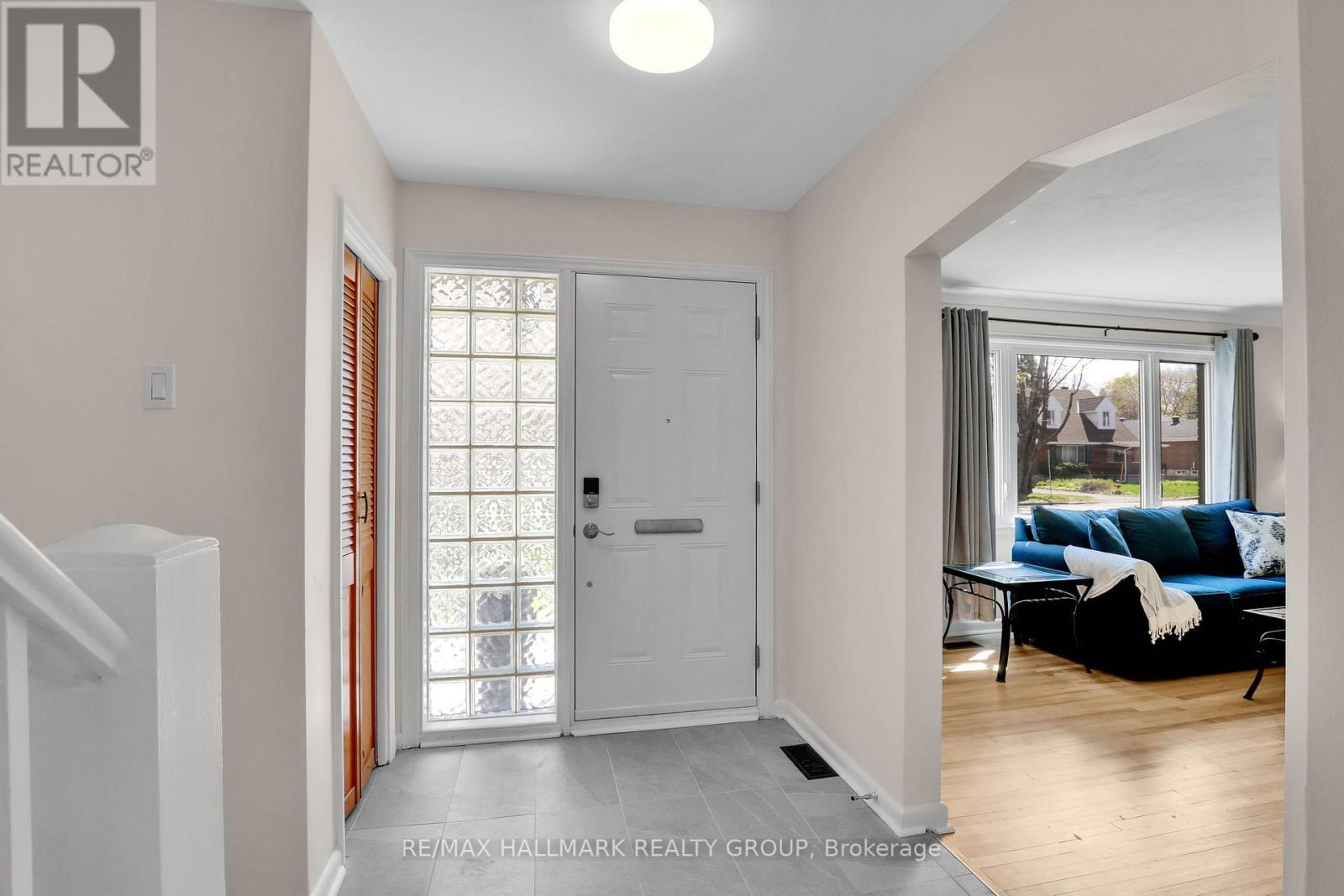 Spacious entry with new tiles.
