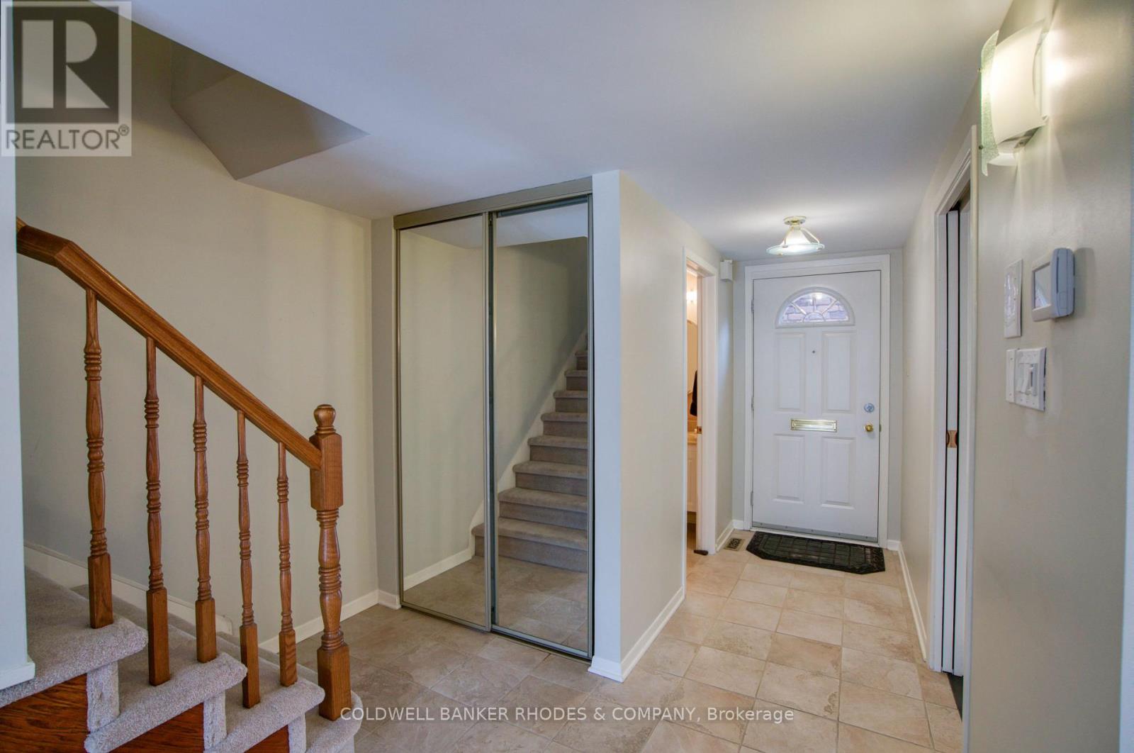 Entrance Foyer with ceramic tile floor and closet