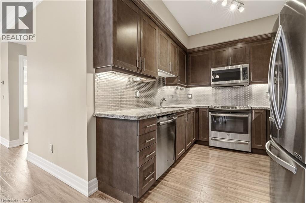 2300 UPPER MIDDLE Road W Unit# 308, Oakville, Ontario, L6M0T4 — Photo 6