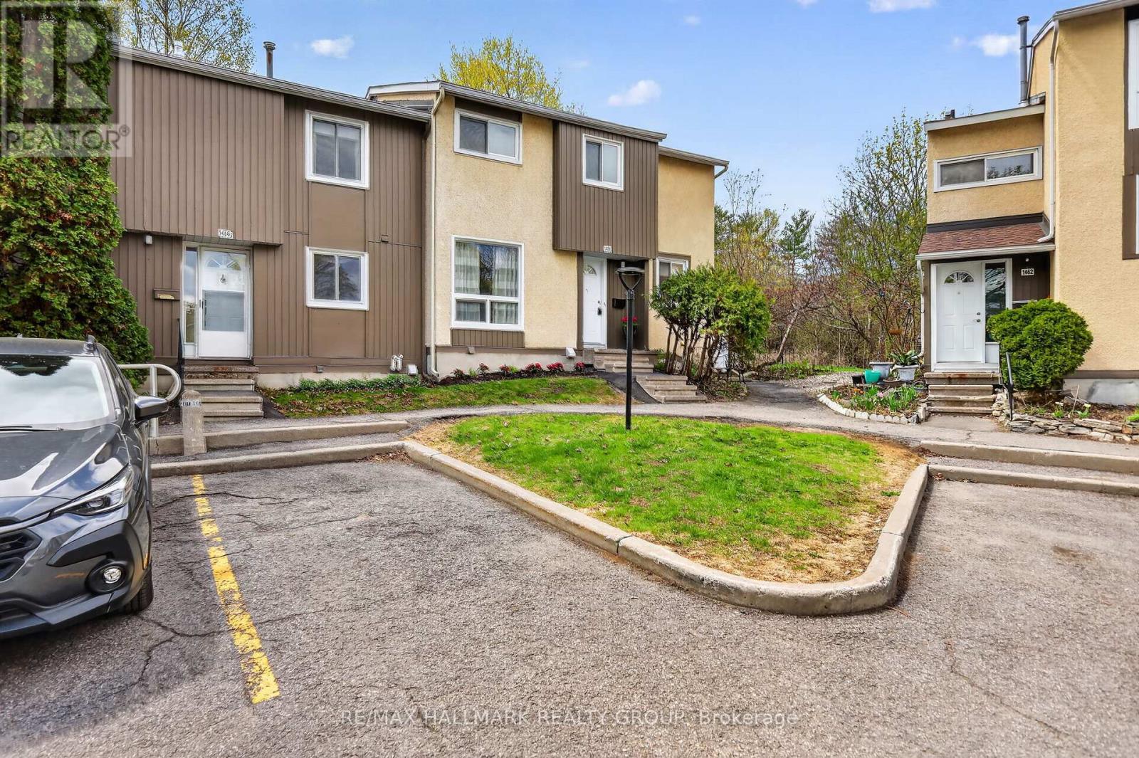 Pathway to greenspace & convenient parking space.