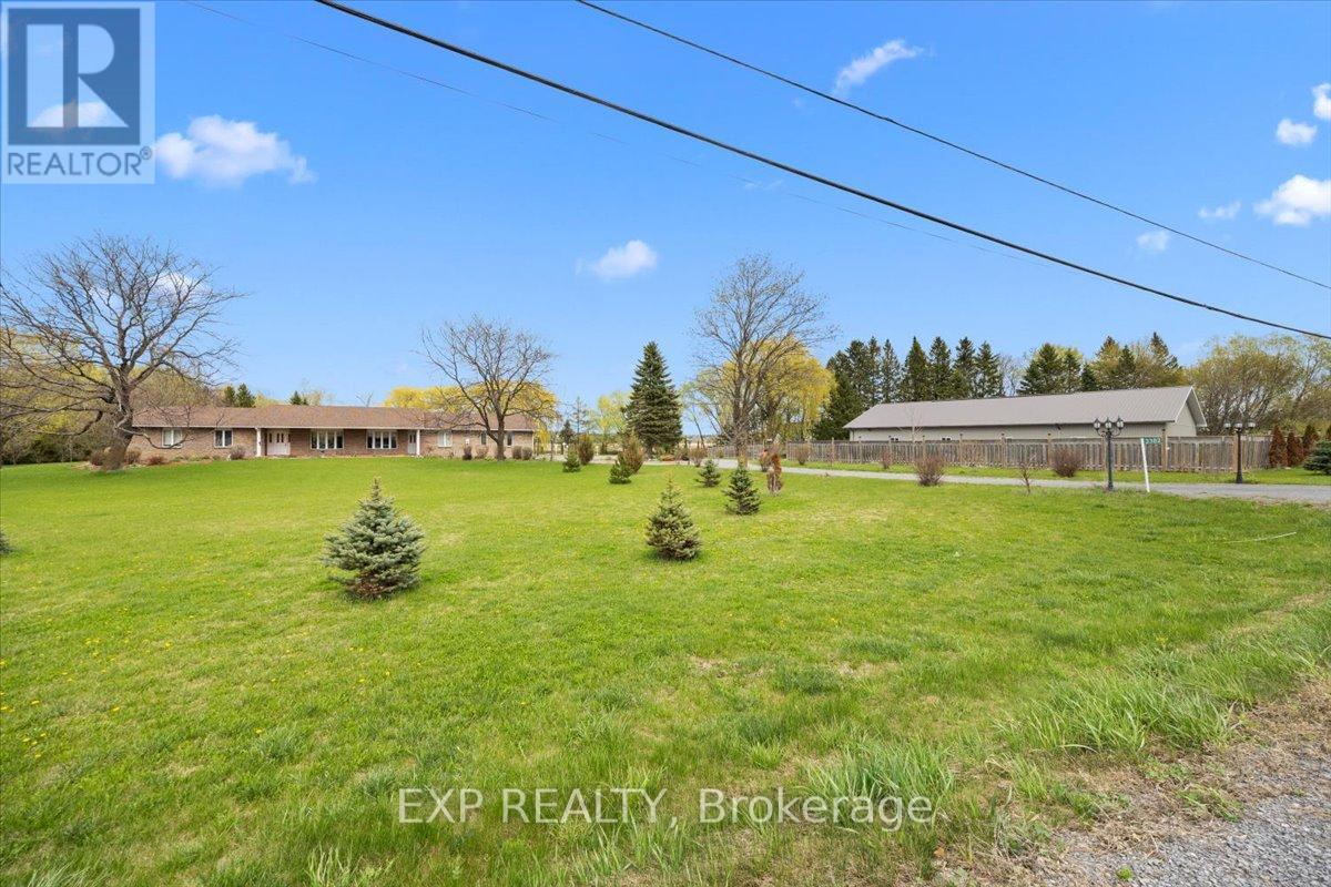 Bungalow and 3200 sq ft garage on 4 acres.