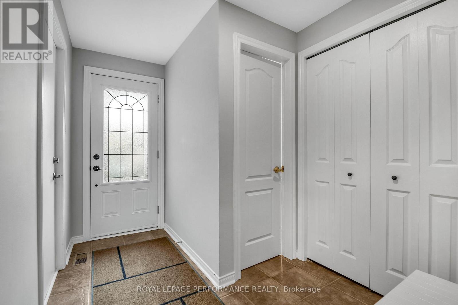 Bright, airy Foyer w/double closet & Powder Room