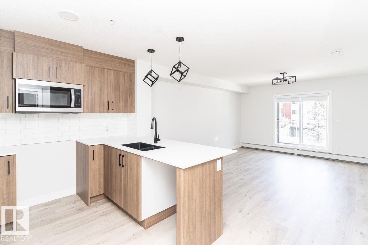 #204 2225 44 AV NW - 4