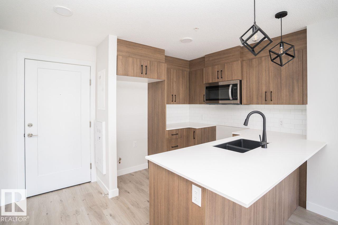 #204 2225 44 AV NW - 1