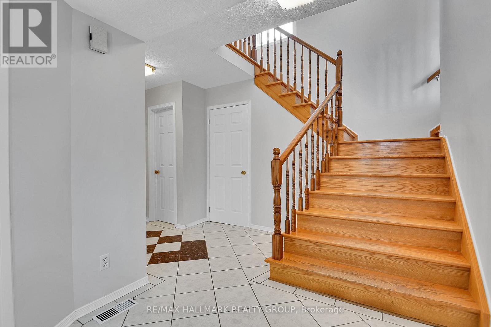 FOYER | doors to powder room, basement