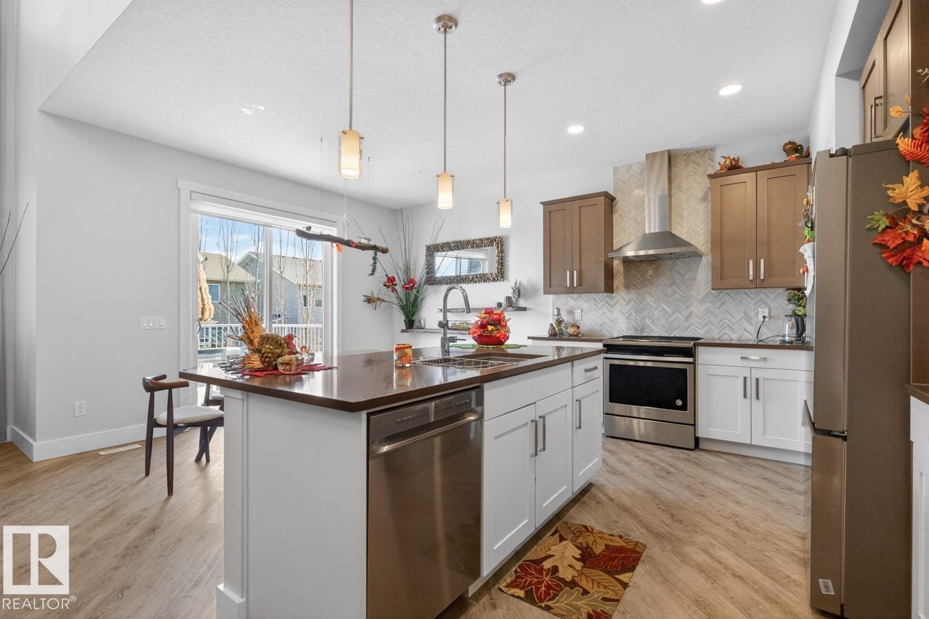 7942 ERASMUS CR NW - 7