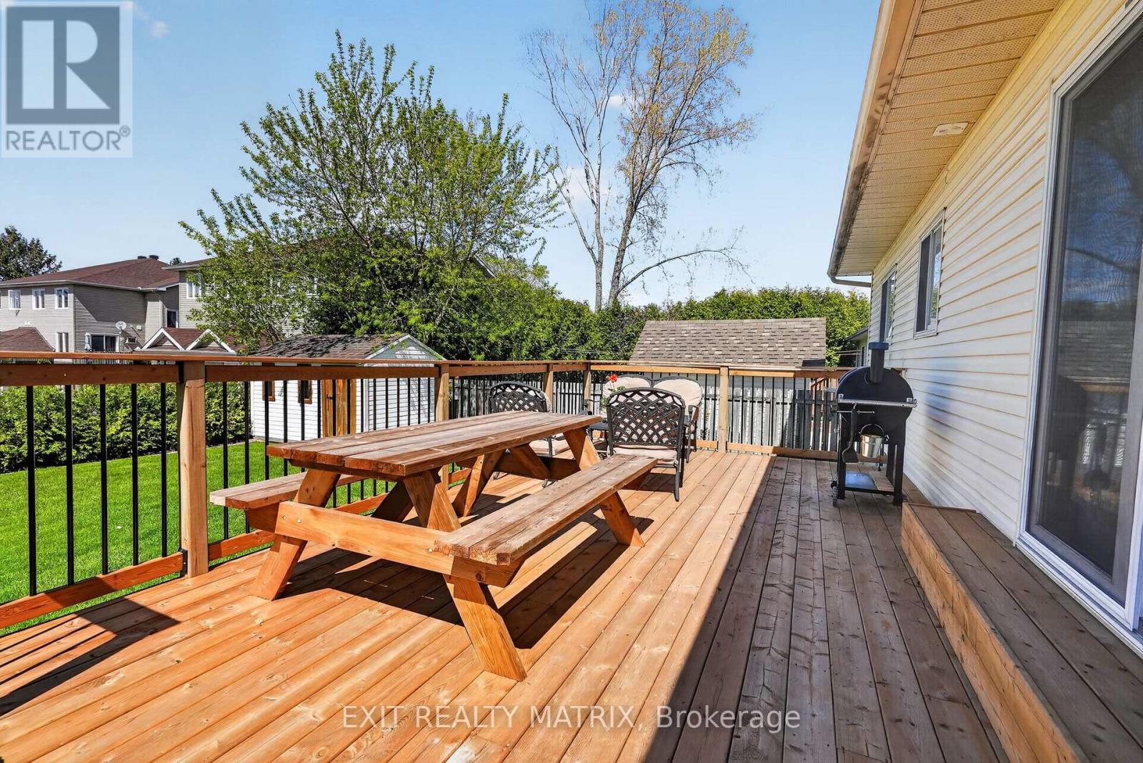 Large, fenced lot w/new deck, fire area & 2 sheds!