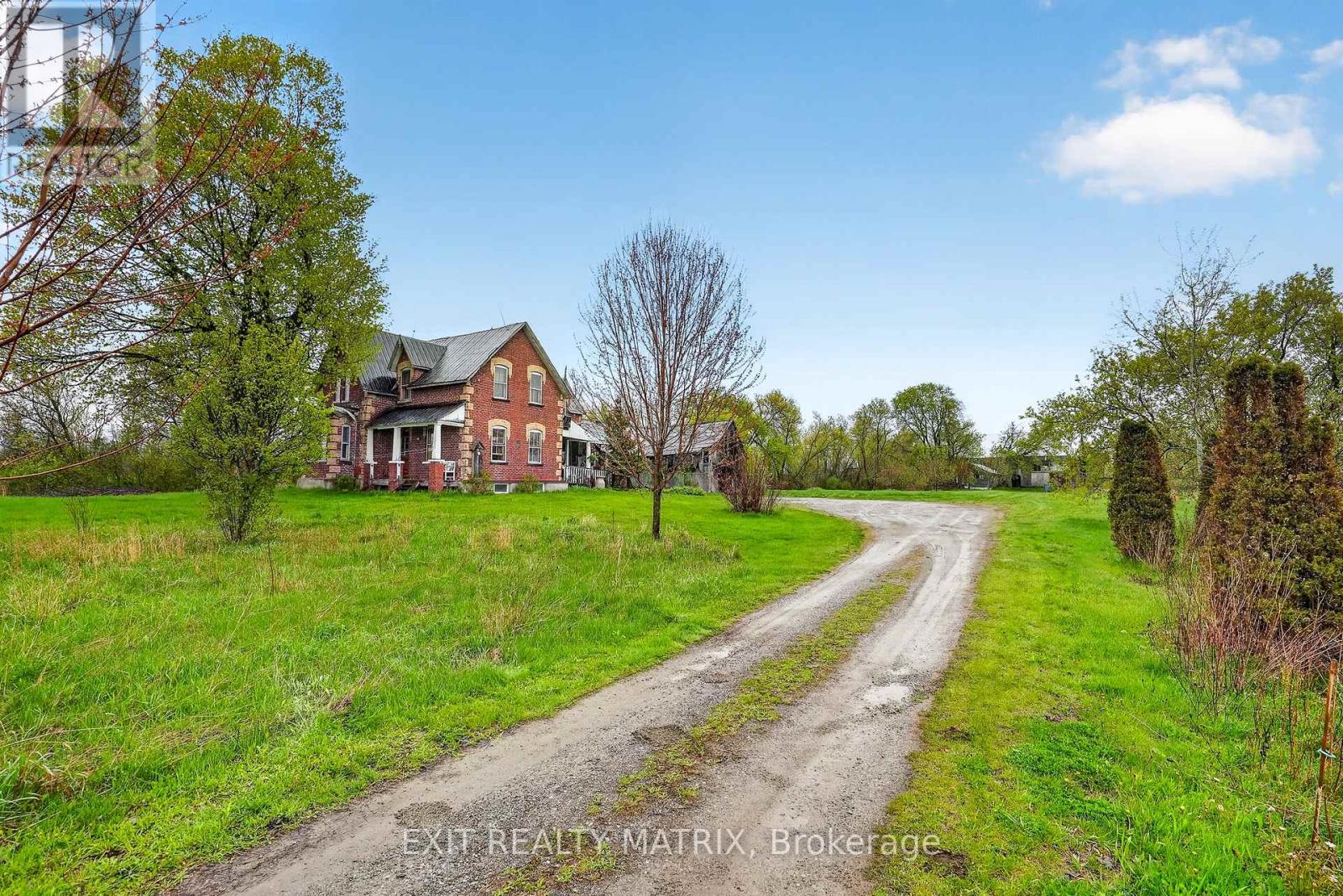 Set back from the road w/ a large berm for privacy